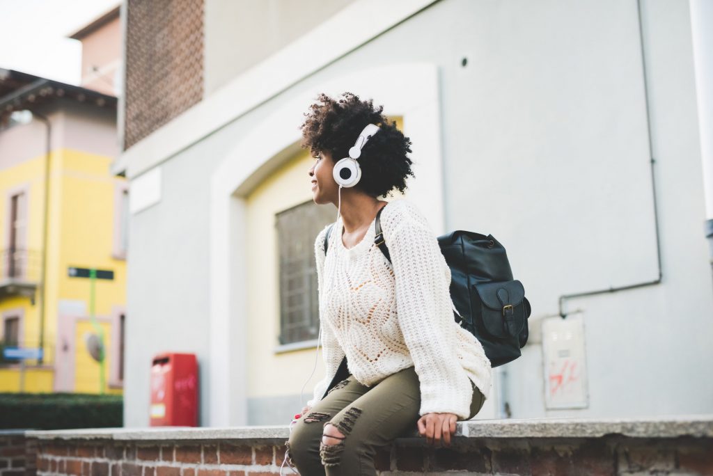 Black woman listening music outdoor at darren yaw Malaysia